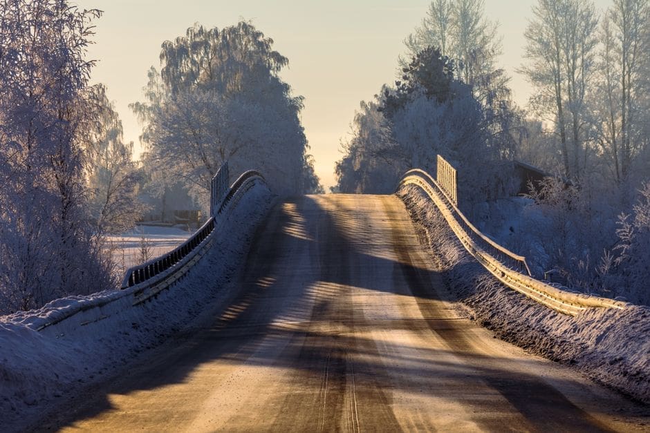 Quiet country road on a frosty winter morning with soft light